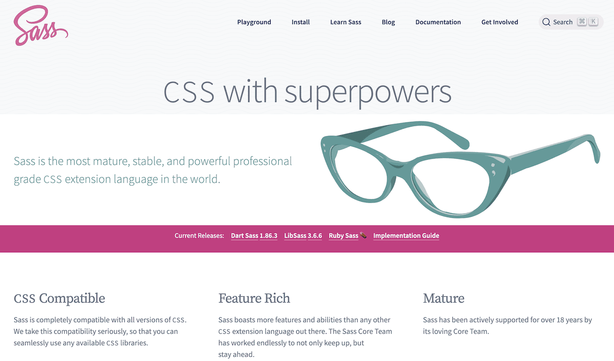 The Sass programming language website home page featuring the Sass logo in pink, a navigation menu, and the tagline 